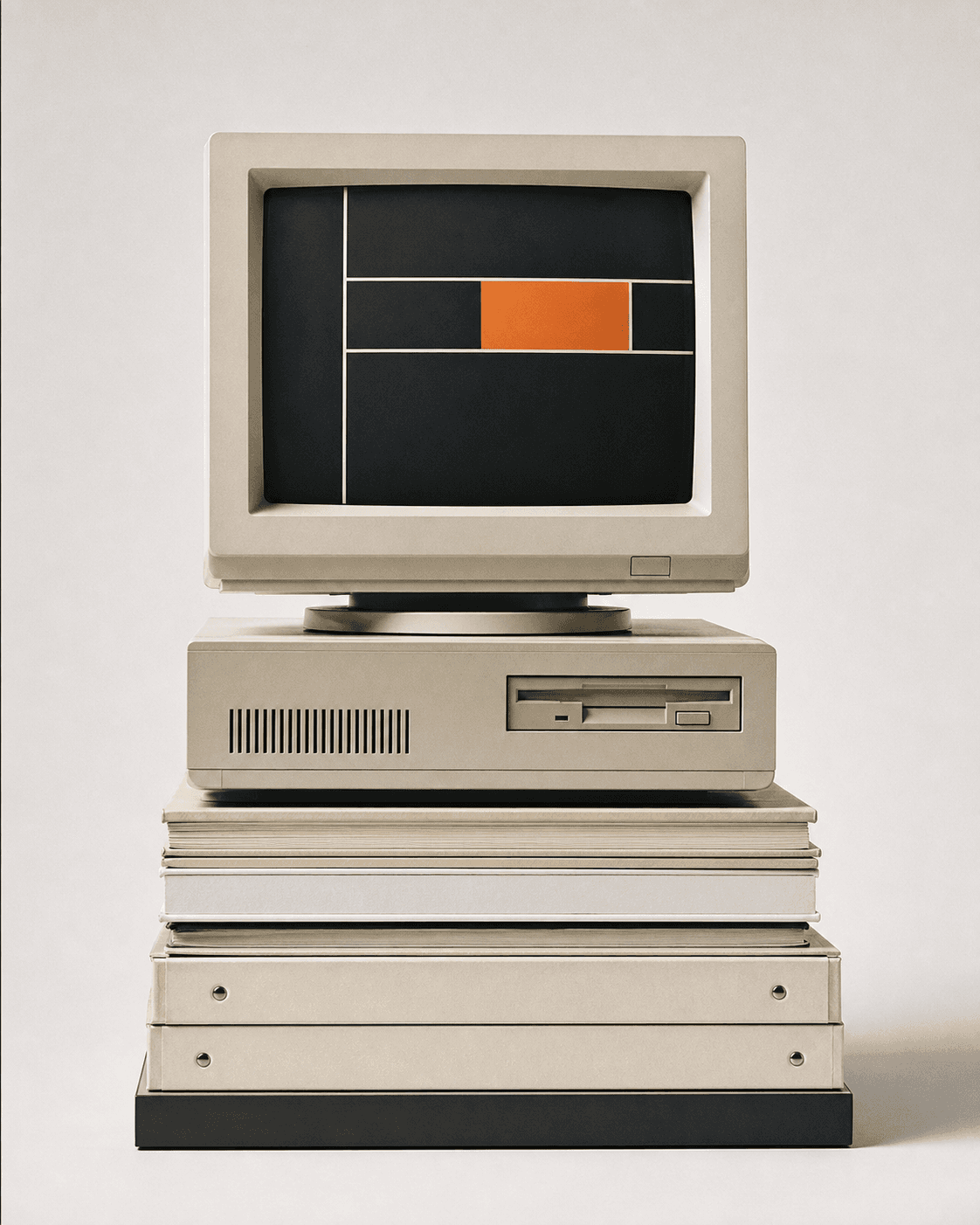 A vintage cream workstation stacked on archival binders